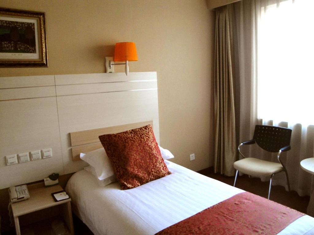 Overseas Chinese International Hotel Csingtao Szoba fotó